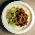 spicy pork shoulder pickled cucumbers over rice