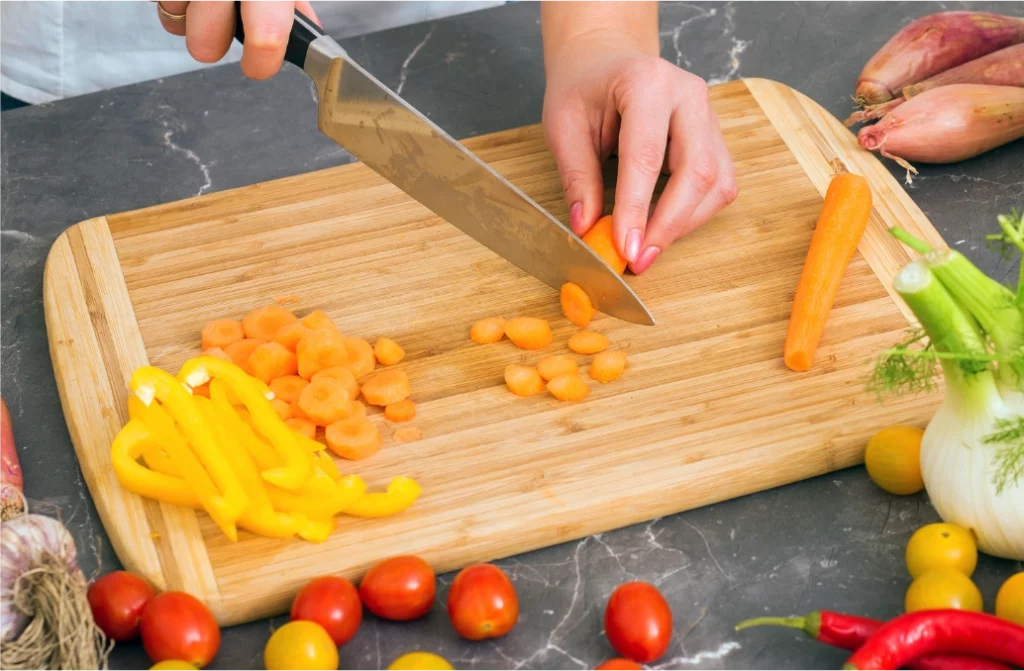 Cutting Board with carrots green peppers